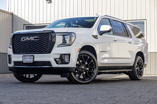 2023 GMC Yukon XL Denali with GMC Factory suspension, 22x9 GMC Stock wheels, and Bridgestone Alenza tires.