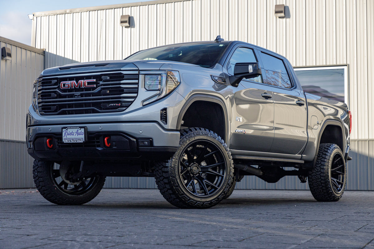 2024 GMC Sierra 1500 AT4 with a 6" Rough Country lift kit, 22x12 Fuel Catalyst wheels, and 35" Fury Country Hunter R/T tires.
