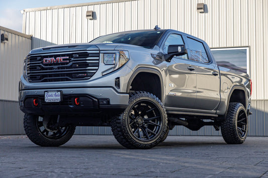 2024 GMC Sierra 1500 AT4 with a 6" Rough Country lift kit, 22x12 Fuel Catalyst wheels, and 35" Fury Country Hunter R/T tires.