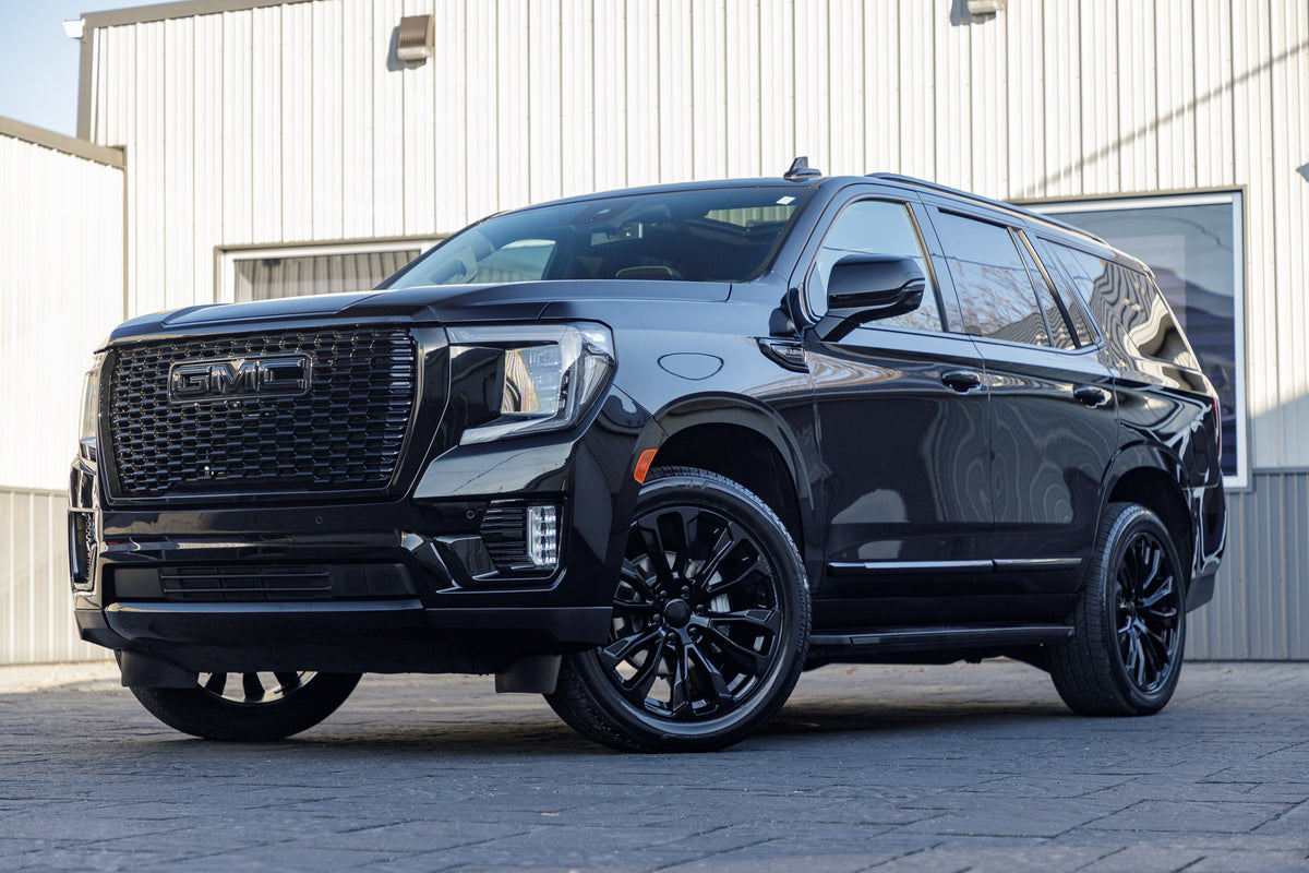 2023 GMC Yukon SLT with GMC Factory suspension, 22x9 GMC Stock wheels, and Bridgestone Alenza tires.
