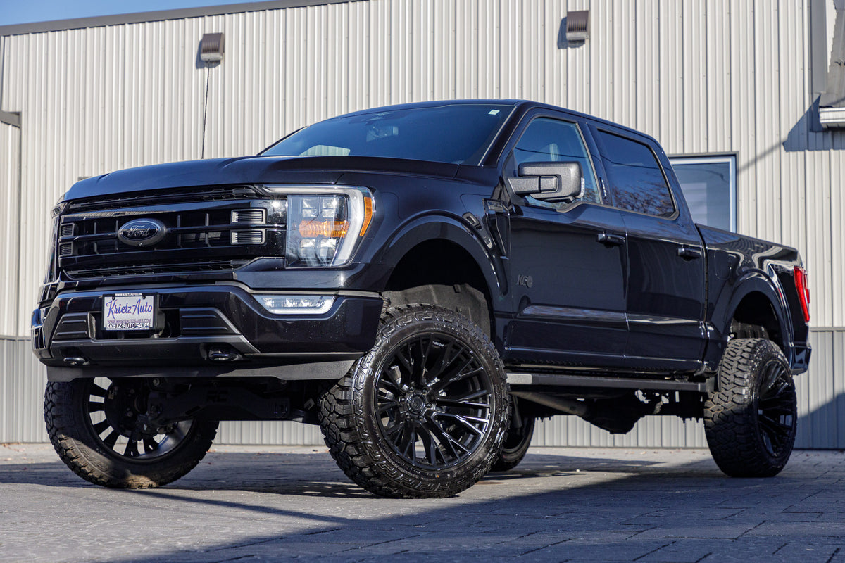 2023 Ford F-150 XLT with a 6" Rough Country lift kit, 22x12 Fuel Rebar wheels, and 35" Fury Country Hunter R/T tires.