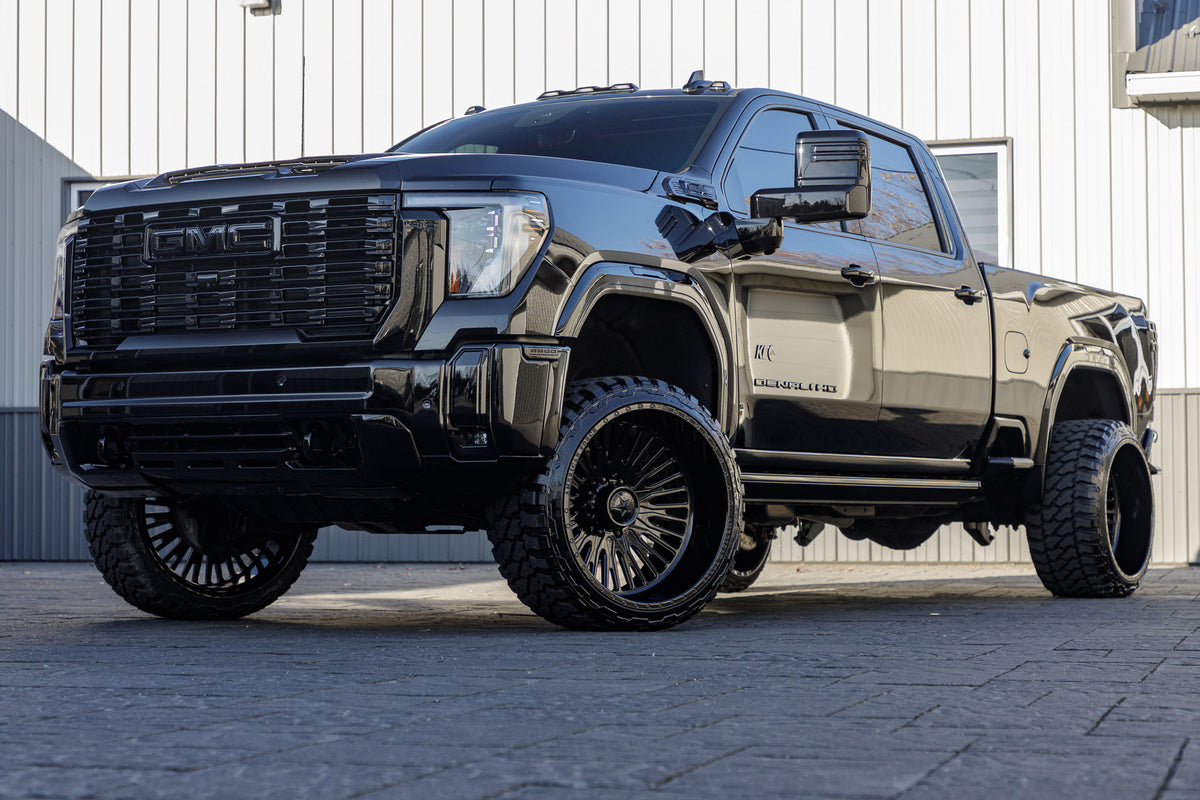 2024 GMC Sierra 2500 Denali with a 3" Cognito leveling kit, 24x14 American Force Spectrum wheels, and 33" Fury Country Hunter M/T tires.