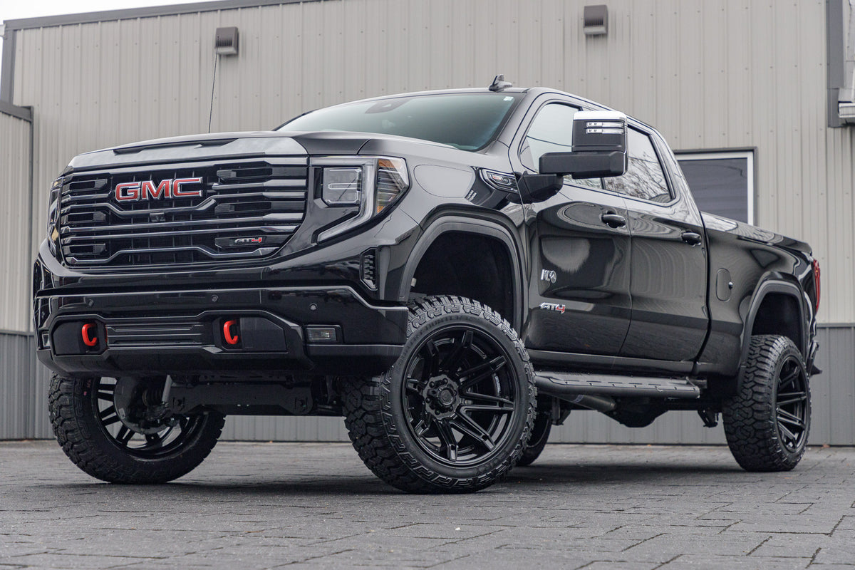2024 GMC Sierra 1500 AT4 with a 6" Rough Country lift kit, 22x12 Fuel Brawl wheels, and 35" Fury Country Hunter R/T tires.