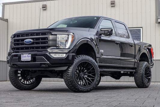 2021 Ford F-150 Lariat with a 6" Rough Country lift kit, 22x12 TIS 566B wheels, and 35" Fury Country Hunter R/T tires.