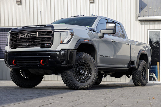 2025 GMC Sierra 2500 AT4X with a 2.5" Cognito lift kit, 20x9 Black Rhino Sentinel wheels, and 37" Toyo Open Country M/T tires.