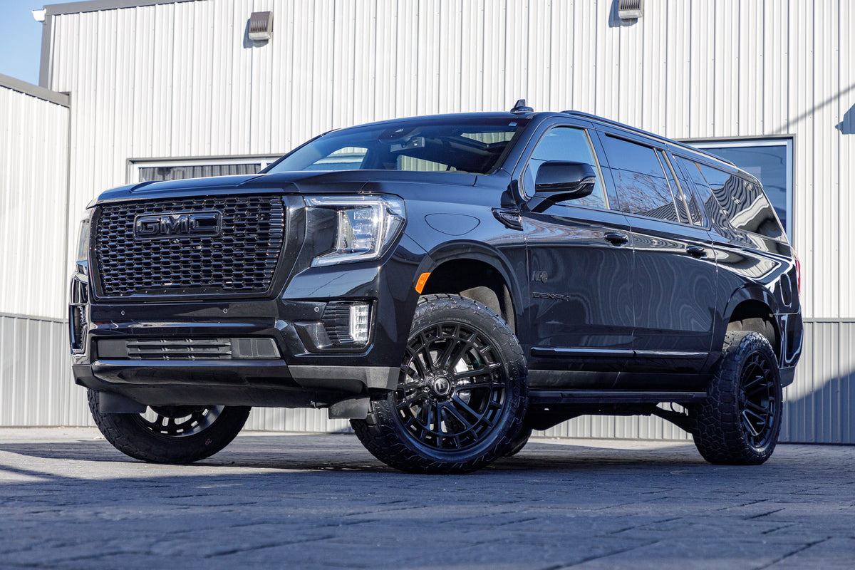 2023 GMC Yukon XL Denali with a 3.5" ReadyLift lift kit, 22x10 Fuel Heater wheels, and 295/50 Toyo Open Country A/T III tires.