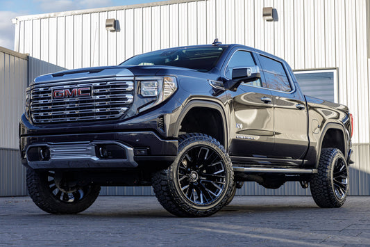 2023 GMC Sierra 1500 Denali with a 6" Rough Country suspension kit, 22x12 Fuel Rebar wheels, and 35" Fury Country Hunter R/T tires.