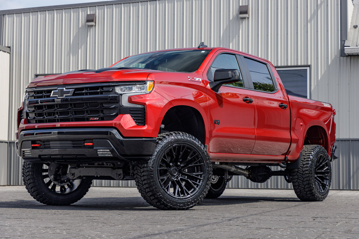 2024 Chevrolet Silverado 1500 LT Trail Boss with a 6" Rough Country lift kit, 22x12 Fuel Rebar wheels, and 3%" Avix Trailtek R/T tires.