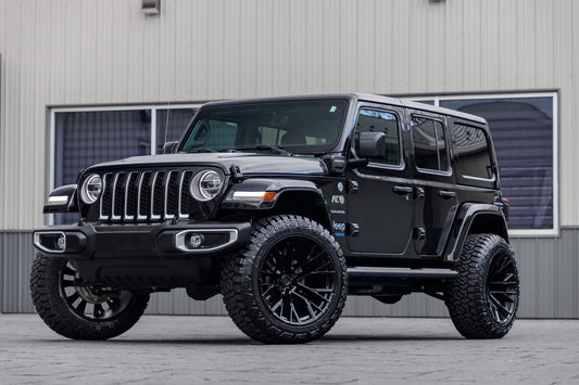 2021 Jeep Wrangler Unlimited Sahara 4XE with a 2,5" Rough Country lift kit, 22x12 Fuel Rebar wheels, and 35" Fury Country Hunter R/T tires.