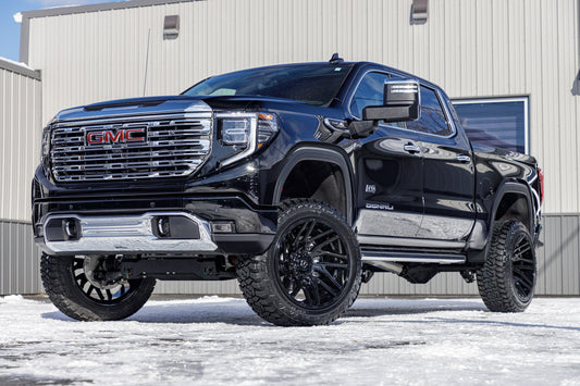 2024 GMC Sierra 1500 Denali with a 6" Rough Country suspension kit, 22x12 TIS 554B wheels, and 35" Fury Country Hunter R/T tires.