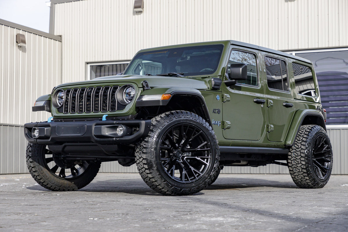 2024 Jeep Wrangler Unlimited Rubicon 4XE with Jeep Stock suspension, 22x12 Fuel Rebar wheels, and 35" Fury Country Hunter R/T tires.