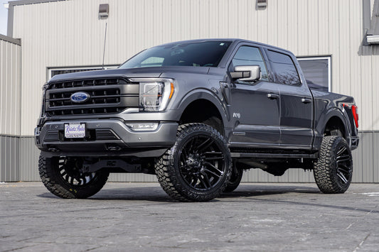 2023 Ford F-150 Lariat with a 6" Rough Country lift kit, 22x12 Fuel Typhoon wheels, and 35" Fury Country Hunter R/T tires.