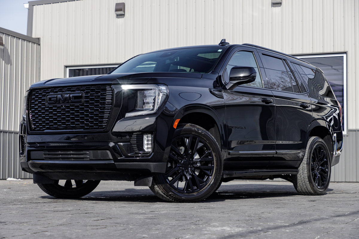 2023 GMC Yukon Denali with GMC Factory suspension, 22x9 GMC Stock wheels, and Bridgestone Alenza tires.