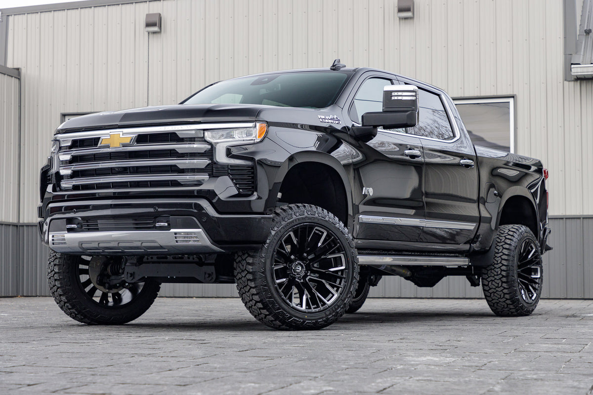 2024 Chevrolet Silverado 1500 High Country with a 6" Rough Country suspension kit, 22x12 Fuel Rebar wheels, and 35" Fury Country Hunter R/T tires.