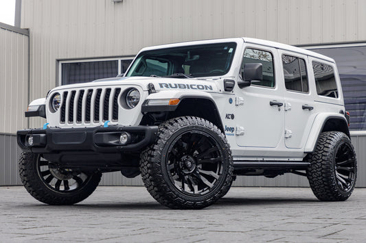 2021 Jeep Wrangler Unlimited Rubicon with Jeep Stock suspension, 22x12 Fuel Blitz wheels, and 35" Fury Country Hunter R/T tires.