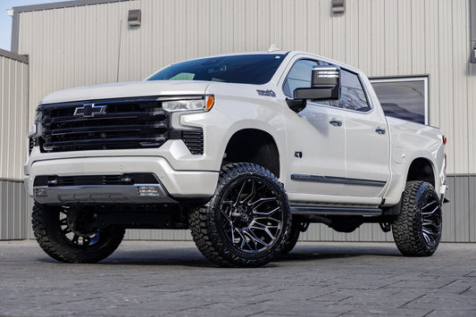 2024 Chevrolet Silverado 1500 High Country with a 6" Rough Country suspension kit, 22x12 Fuel Twitch wheels, and 35" Fury Country Hunter R/T tires.