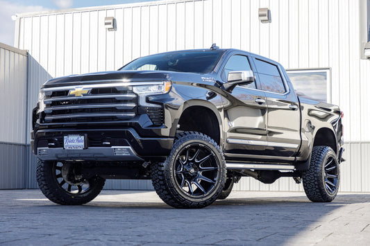 2024 Chevrolet Silverado 1500 High Country with a 6" Rough Country suspension kit, 22x12 Fuel Super C wheels, and 35" Fury Country Hunter R/T tires.