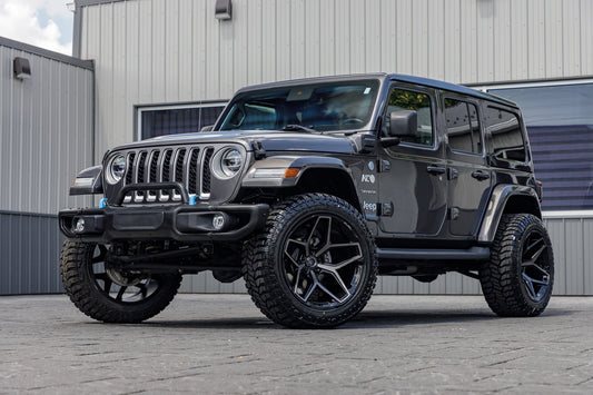 2022 Jeep Wrangler Unlimited Sahara 4XE with a 2.5" Rough Country lift kit, 22x12 Fuel Flux wheels, and 35" Avix Trailtek R/T tires.