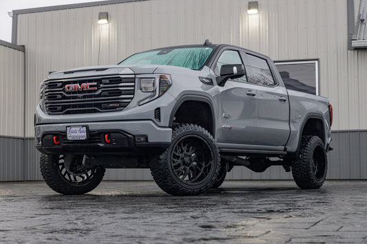 2024 GMC Sierra 1500 AT4 with a 6" Rough Country lift kit, 22x12 TIS 544B wheels, and 35" Fury Country Hunter R/T tires.