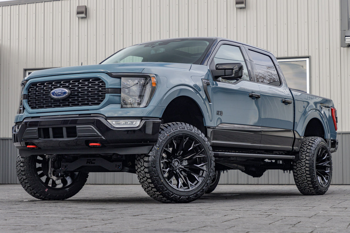 2023 Ford F-150 XLT with a 6" Rough Country lift kit, 22x12 Fuel Flame wheels, and 35" Fury Country Hunter R/T tires.