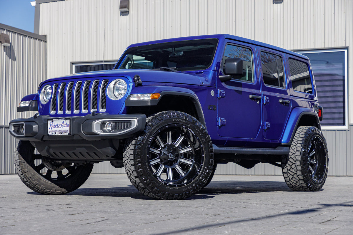 2019 Jeep Wrangler Unlimited Sahara with a 2.5" Rough Country lift kit, 22x12 Fuel Hardline wheels, and 35" Nitto Ridge Grappler tires.