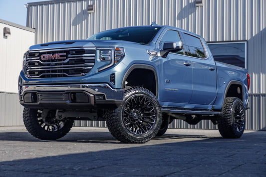 2024 GMC Sierra 1500 SLT with a 6" Rough Country lift kit, 22x12 Fuel Strike wheels, and 35" Avix Trailtek R/T tires.