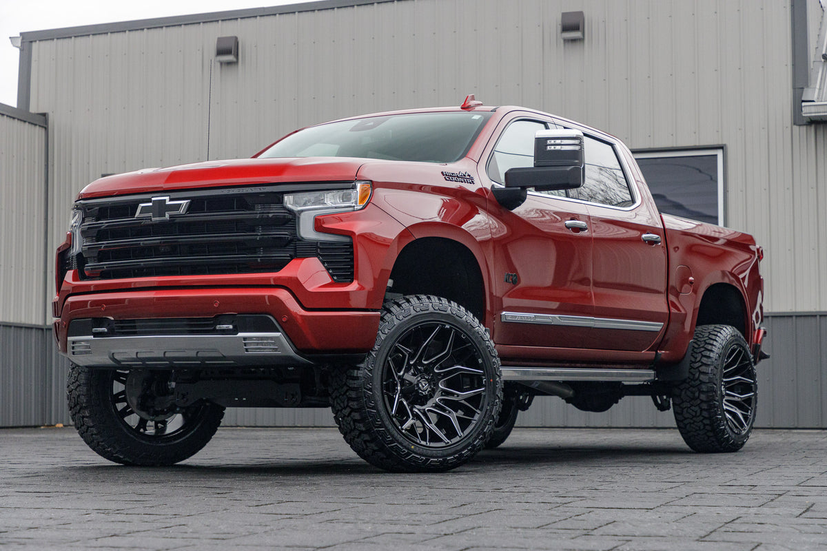 2024 Chevrolet Silverado 1500 High Country with a 6" Rough Country lift kit, 22x12 Fuel Twitch wheels, and 35" Fury Country Hunter R/T tires.