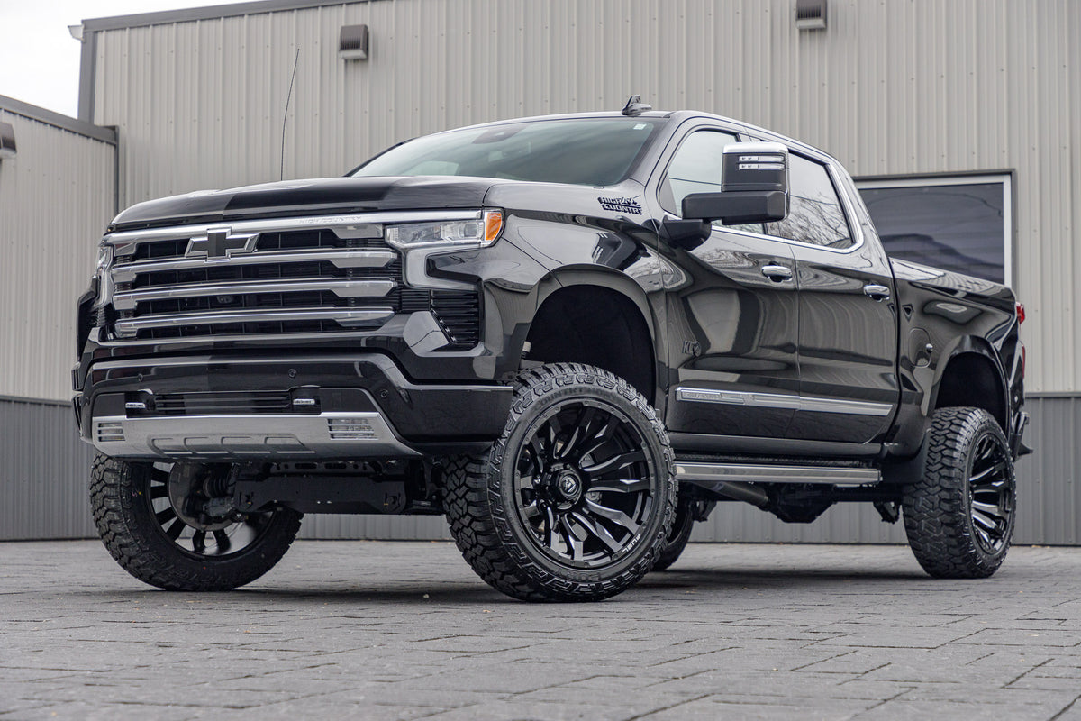 2024 Chevrolet Silverado 1500 High Country with a 6" Rough Country lift kit, 22x12 Fuel Blitz wheels, and 35" Fury Country Hunter R/T tires.