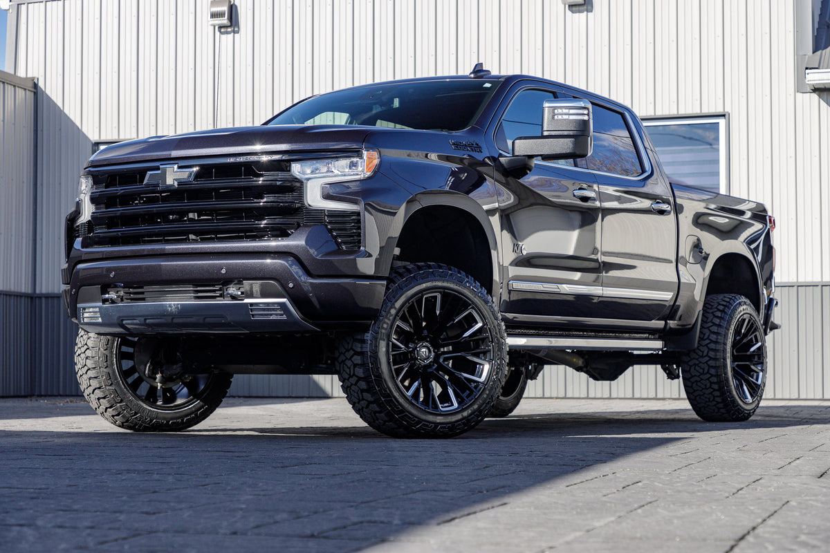 2024 Chevrolet Silverado 1500 High Country with a 6" Rough Country lift kit, 22x12 Fuel Rebar wheels, and 35" Fury Country Hunter R/T tires.