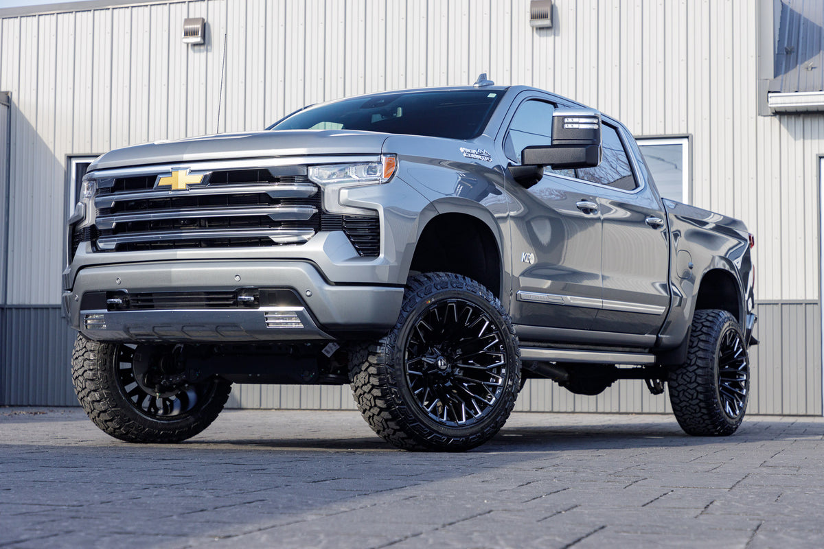 2024 Chevrolet Silverado 1500 High Country with a 6" Rough Country suspension kit, 22x12 Fuel Strike wheels, and 35" Fury Country Hunter tires.