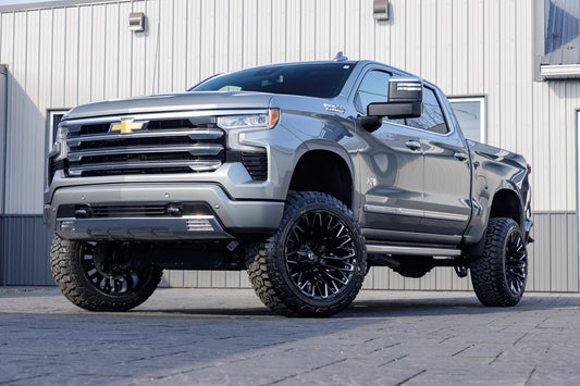 2024 Chevrolet Silverado 1500 High Country with a 6" Rough Country suspension kit, 22x12 Fuel Strike wheels, and 35" Fury Country Hunter tires.