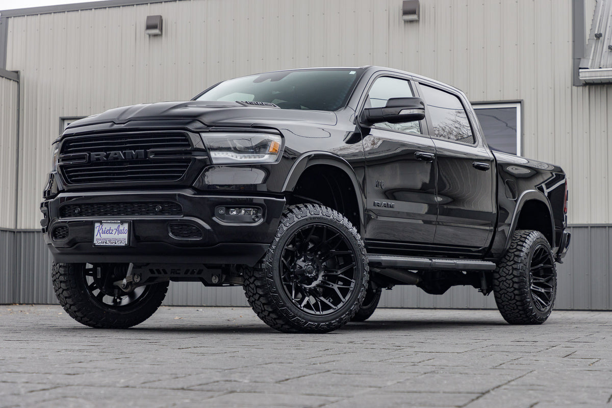 2022 Ram 1500 Laramie with a 6" Rough Country lift kit, 22x12 Fuel Twitch wheels, and 35" Fury Country Hunter R/T tires.