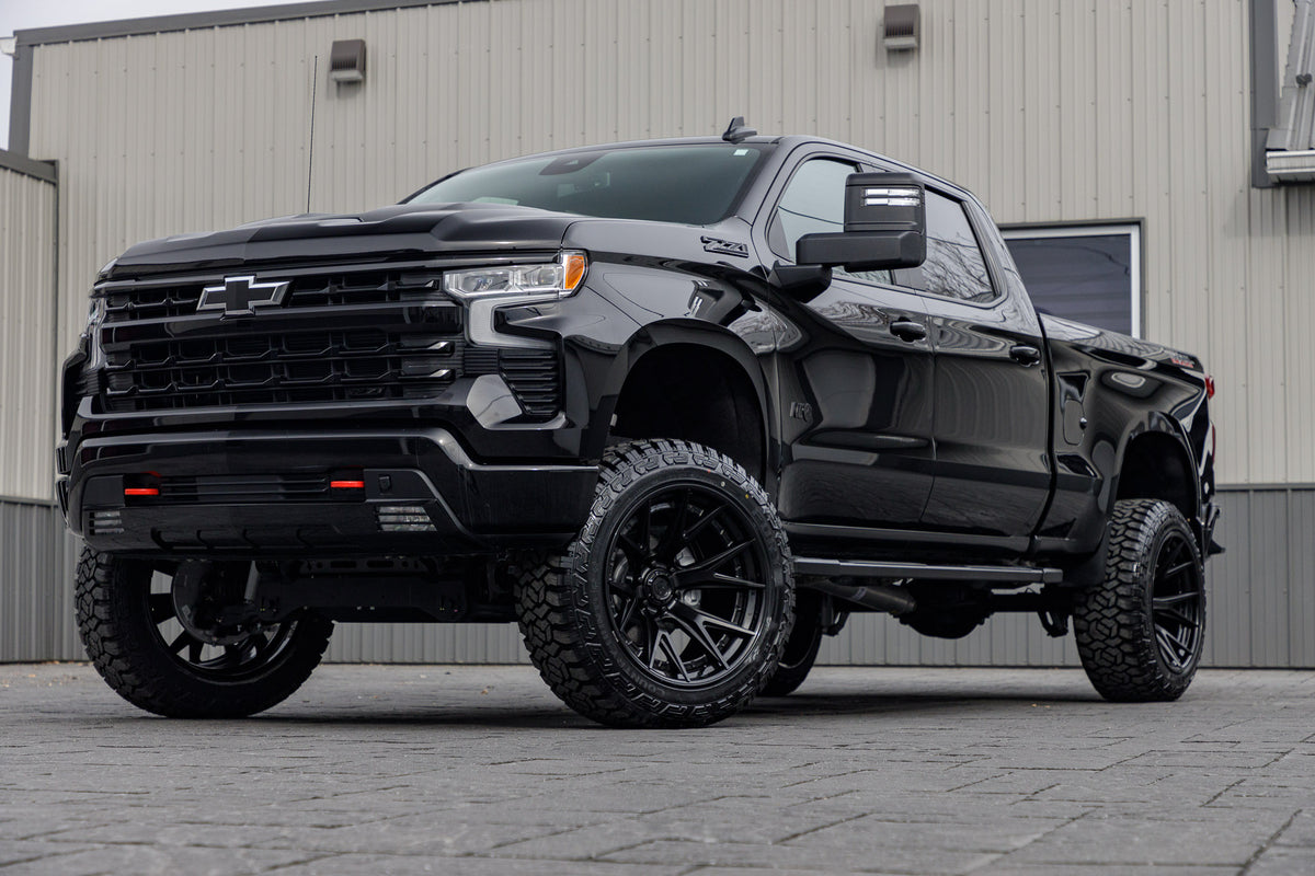 2024 Chevrolet Silverado 1500 LT Trail Boss with a 6" Rough Country lift kit, 22x12 Fuel Catalyst wheels, and 35" Fury Country Hunter R/T tires.
