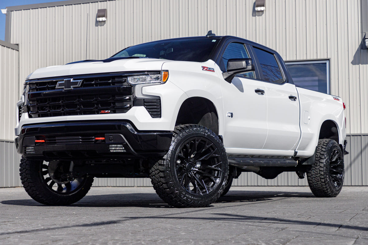 2024 Chevrolet Silverado 1500 LT Trail Boss with a 6" Rough Country lift kit, 22x12 Fuel Flame wheels, and 35" Fury Country Hunter R/T tires.