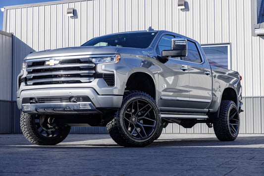 2024 Chevrolet Silverado 1500 High Country with a 6" Rough Country lift kit, 22x12 Fuel Flux wheels, and Fury Country Hunter R/T tires.