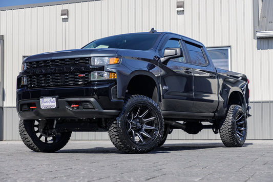 2021 Chevrolet Silverado 1500 Custom Trail Boss with a 6" Rough Country lift kit, 22x12 Fuel Super C wheels, and 35" Fury Country Hunter R/T tires.
