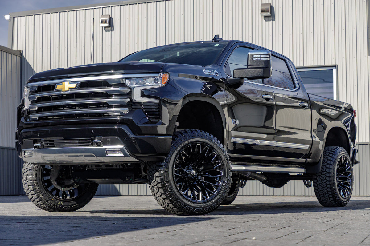 2024 Chevrolet Silverado 1500 High Country with a 6" Rough Country lift kit, 22x12 Fuel Strike wheels, and 35" Fury Country Hunter R/T tires.