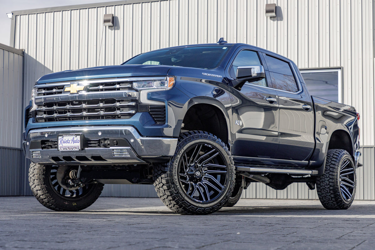 2023 Chevrolet Silverado 1500 LTZ with a 6" Rough Country lift kit, 22x12 Fuel Typhoon wheels, and 35" Fury Country Hunter R/T tires.