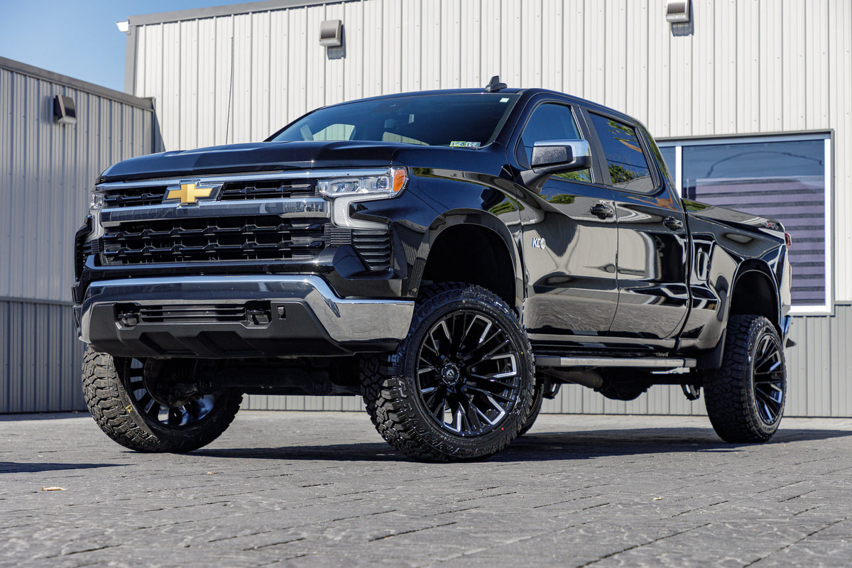 2023 Chevrolet Silverado 1500 LT with a 6" Rough Country lift kit, 22x12 Fuel Rebar wheels, and 35" Avix Trailtek R/T tires.
