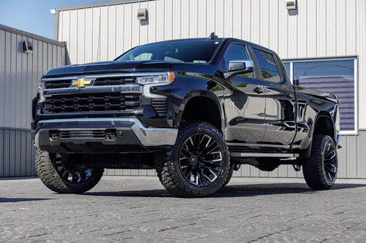 2023 Chevrolet Silverado 1500 LT with a 6" Rough Country lift kit, 22x12 Fuel Rebar wheels, and 35" Avix Trailtek R/T tires.