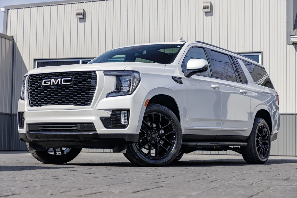 2024 GMC Yukon XL SLT with GMC Factory suspension, 22x9 GMC Stock wheels, and Bridgestone Alenza tires.