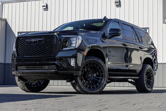 2024 GMC Yukon Denali with a 3" ReadyLift lift kit, 22x10 Fuel Heater wheels, and 295/50 Toyo Open Country A/T III tires.