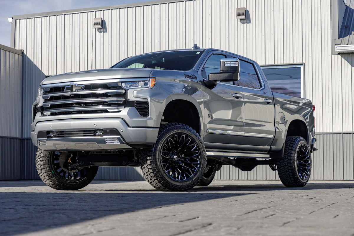 2024 Chevrolet Silverado 1500 High Country with a 6" Rough Country lift kit, 22x12 Fuel Strike wheels, and 35" Fury Country Hunter R/T tires.