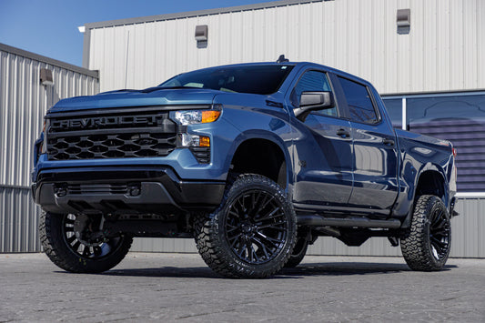 2024 Chevrolet Silverado 1500 Custom Trail Boss with a 6" Rough Country lift kit, 22x12 Fuel Rebar wheels, and 35" Fury Country Hunter R/T tires.