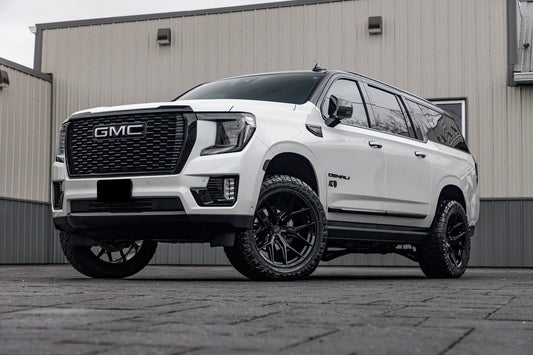 2024 GMC Yukon XL Denali Ultimate with a 2" ReadyLift lift kit, 22x10 Vossen HF6-4 wheels, and 295/50 Nitto Ridge Grappler tires.
