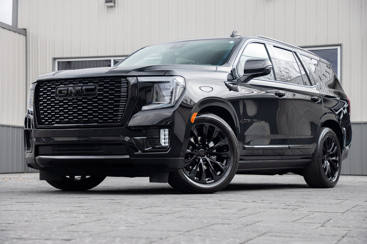 2024 GMC Yukon Denali Ultimate with GMC Factory suspension, 22x9 GMC Stock wheels, and Bridgestone Alenza tires.