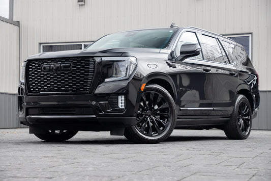 2024 GMC Yukon Denali Ultimate with GMC Factory suspension, 22x9 GMC Stock wheels, and Bridgestone Alenza tires.