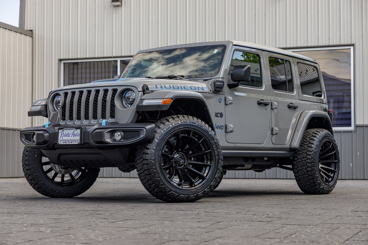 2023 Jeep Wrangler Unlimited Rubicon 4xe Gray with a 2.5 inch rough country lift kit 22z12 Fuel Burn Wheels and 35 inch Fury Country Hunter R/T tires