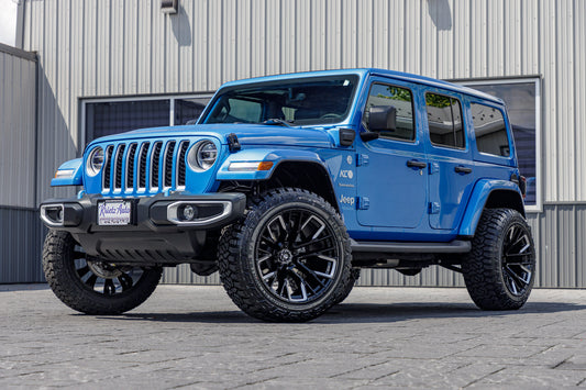 2022 Jeep Wrangler Unlimited Sahara 4xe blue with 2.5 " rough country lift kit 22x12 fuel rebar wheels and 35 inch fury country hunter R/T tires