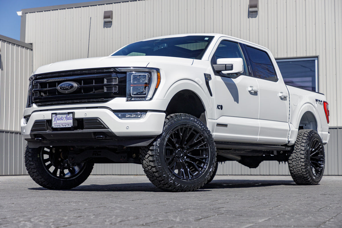 2023 Ford F-150 Lariat with a 6" Rough Country lift kit, 22x12 Fuel Rebar wheels, and 35" Fury Country Hunter R/T tires.